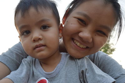 Portrait of cute boy with mother