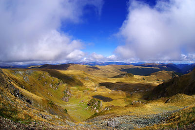 Panoramic view of landscape against cloudy sky