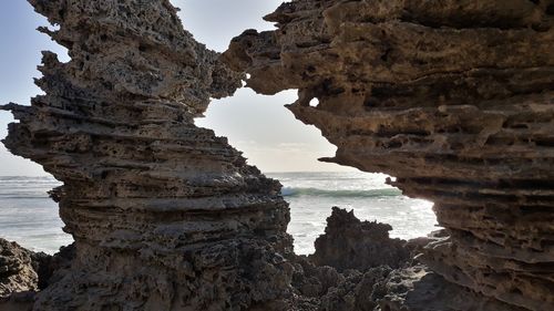 Wide view of ocean through natural window