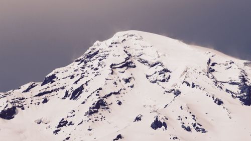 High section of snow covered mountain peak