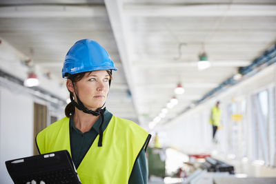 Portrait of man working with camera