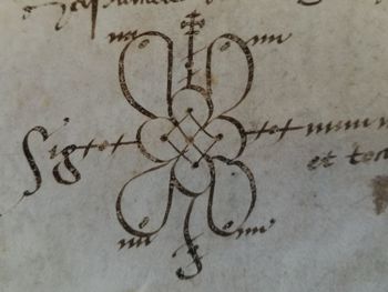 Close-up of text on heart shape on sand