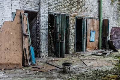 Old abandoned house against building