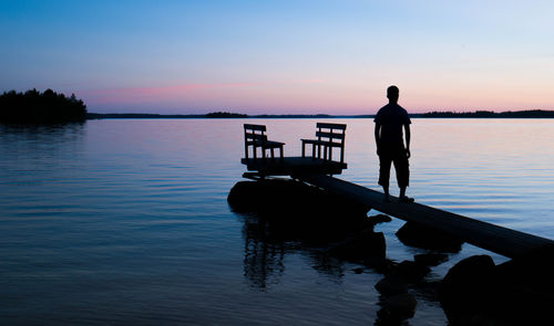 Silhouette of pier at sunset