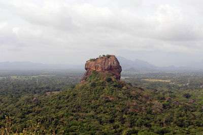 Rock formations on landscape against sky