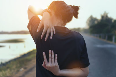 Rear view of couple standing in water