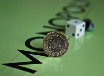 Close-up of coins on table