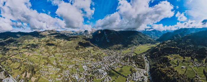 Panoramic view of land and mountains against sky